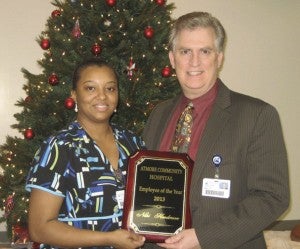     Atmore Community Hospital administrator Bill Perkins, right, presents Niki Henderson with the ACH Employee of the Year award.