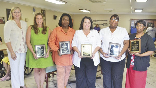 Atmore Nursing Center employees were honored Wednesday for their career milestones. Shown are, left to right, ANC administrator Cindy Lee, Julie Ray, Angelia Montgomery, Marcella Wilson, Ellen Salter and Darlene McMillan. Not shown are Melissa Lindsey and Glenda Arnold.