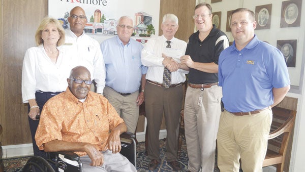 Shown receiving the Good Roots grant are: seated city council member Cornell “Coach” Torrence; standing, left to right, city council members Susan Smith, Chris Walker, Webb Nall, Mayor Jim Staff, Alabama Power branch manager Ricky Martin and city council member Chris Harrison.