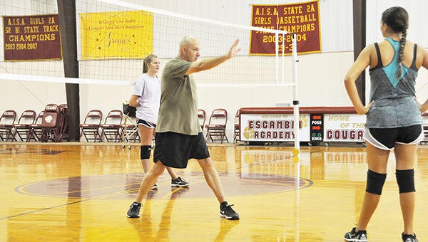 New EA volleyball coach Steve Livingston (right) instructs during a recent practice. | Andrew garner/atmore advance